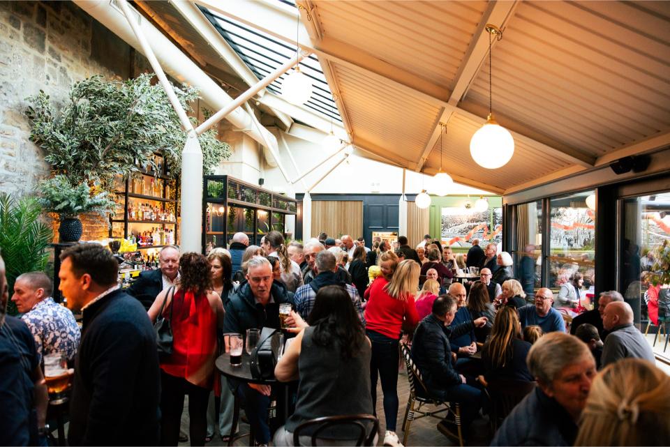 Busy indoor bar with people socializing